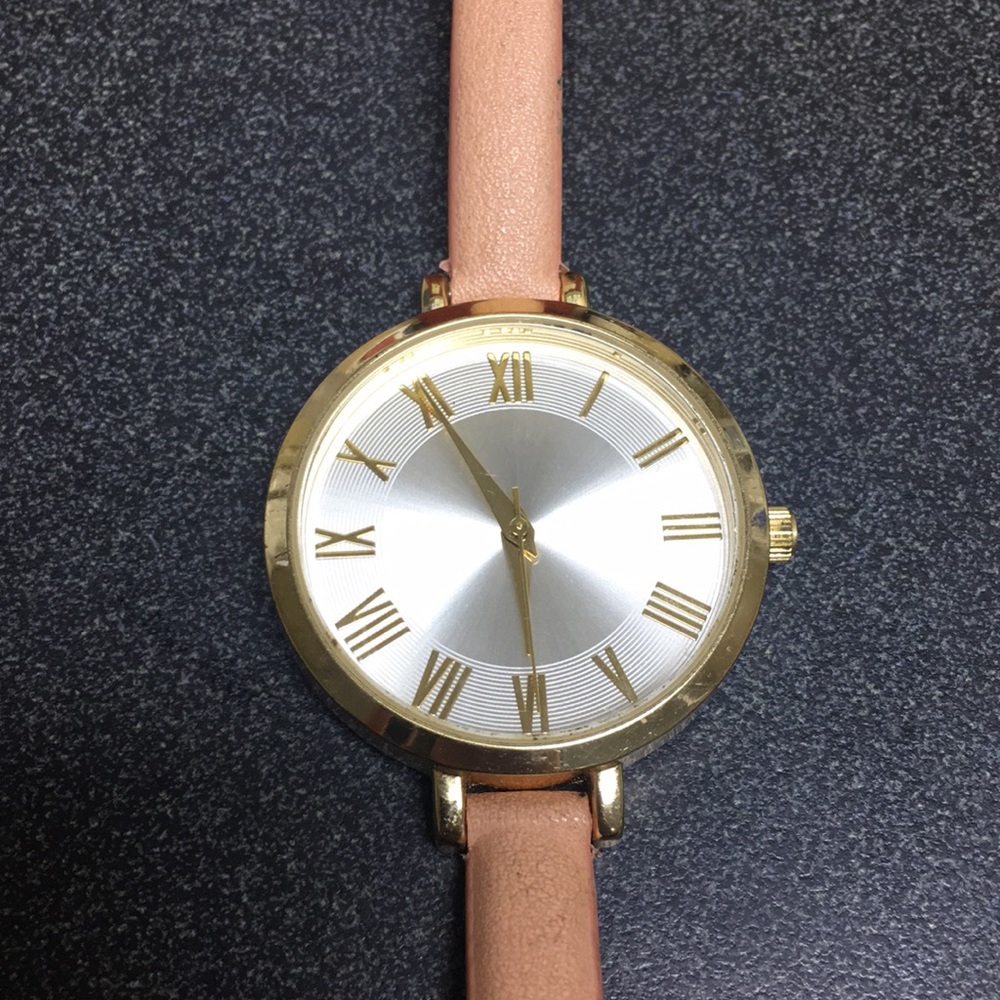 Gold and light pink watch